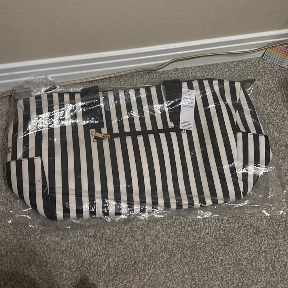 Alice + Olivia duffle bag black and white stripes. New in bag